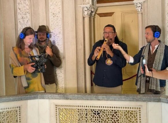 Standing Bears playing the flute